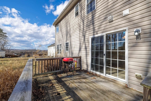 wooden deck featuring grilling area