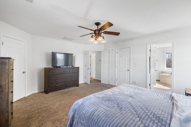 bedroom featuring light colored carpet, visible vents, a ceiling fan, connected bathroom, and baseboards