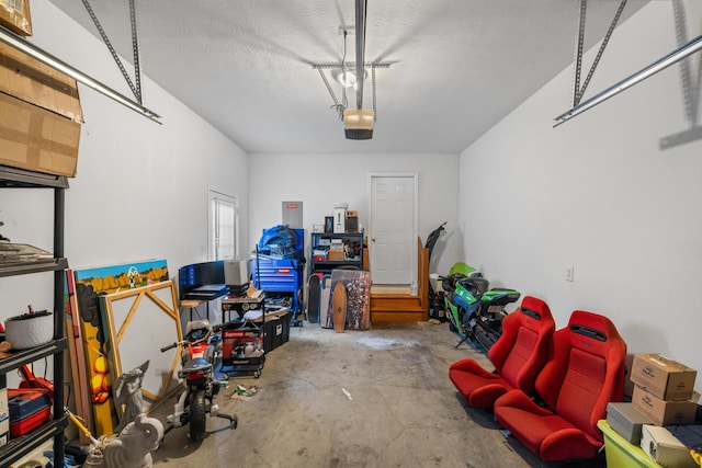 garage featuring electric panel and a garage door opener