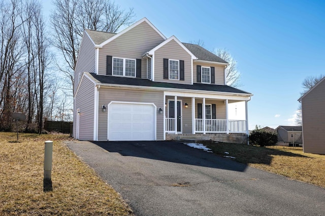 traditional-style house featuring driveway, a shingled roof, a garage, and a porch