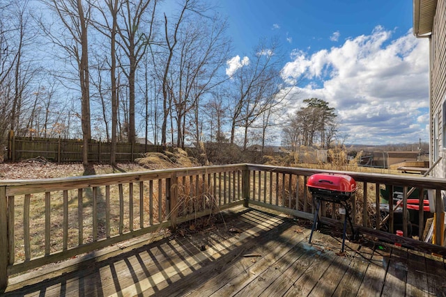 wooden terrace featuring fence and grilling area