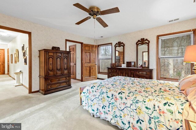 carpeted bedroom with ceiling fan