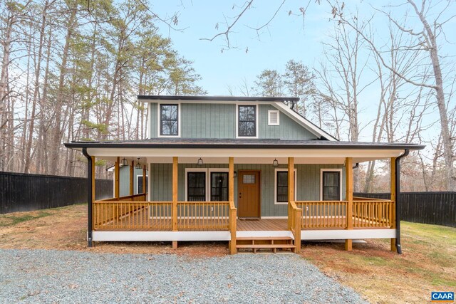 view of front of house with covered porch and a front yard