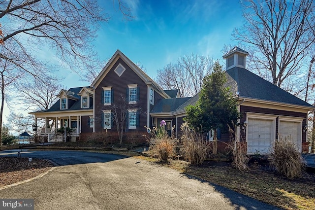 view of front of property with a garage and driveway