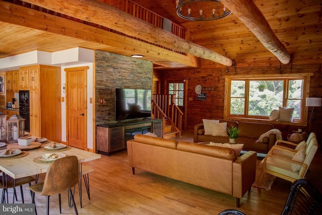 living area with light wood-style floors, wood ceiling, stairway, and beamed ceiling