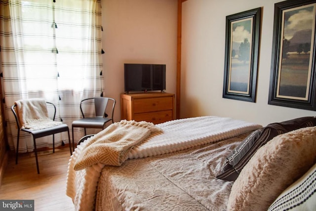 bedroom featuring wood finished floors