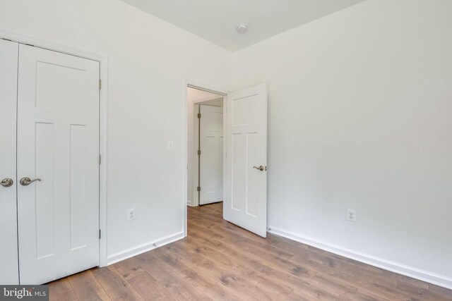 unfurnished bedroom featuring light wood-type flooring