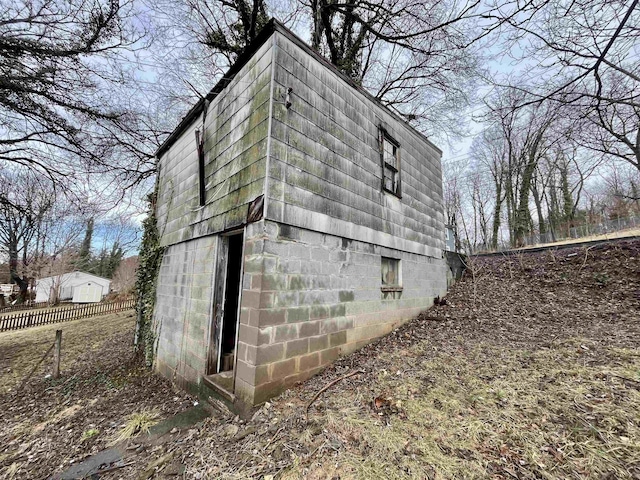 view of property exterior featuring an outbuilding