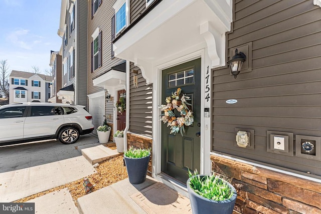 doorway to property with a residential view