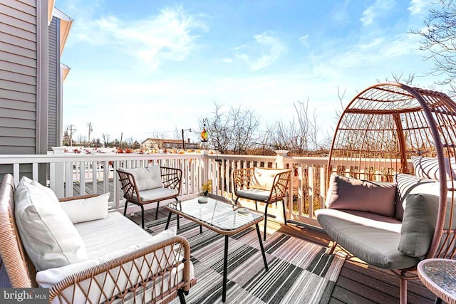 wooden deck featuring outdoor lounge area