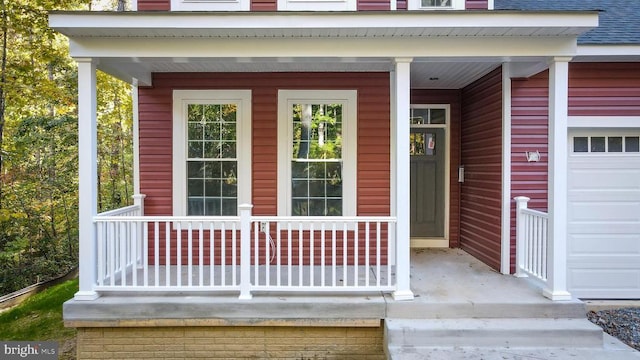 doorway to property featuring covered porch