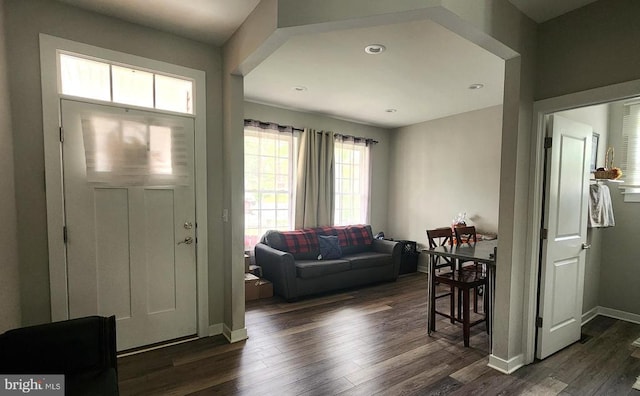 entryway with baseboards, recessed lighting, and dark wood-type flooring