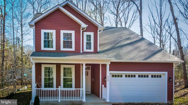traditional-style house with a garage, a porch, and roof with shingles