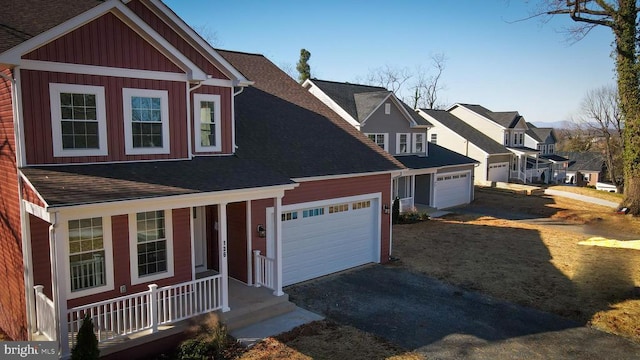 view of front of property with a residential view, a shingled roof, an attached garage, aphalt driveway, and covered porch