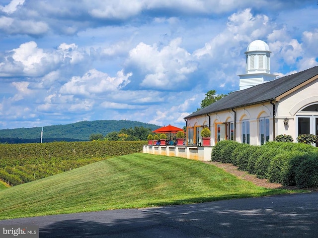 view of yard featuring a mountain view and a gazebo