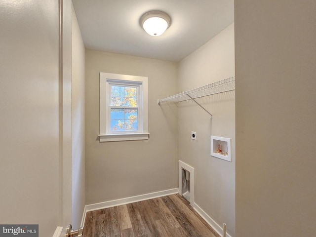 laundry room with laundry area, wood finished floors, baseboards, hookup for a washing machine, and electric dryer hookup