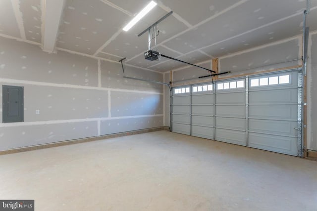 garage featuring a garage door opener and electric panel
