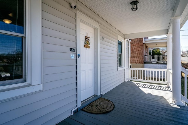 property entrance featuring covered porch