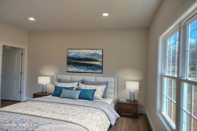 bedroom with baseboards, dark wood-style flooring, and recessed lighting