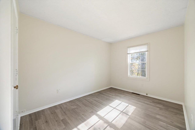 empty room with light wood-type flooring