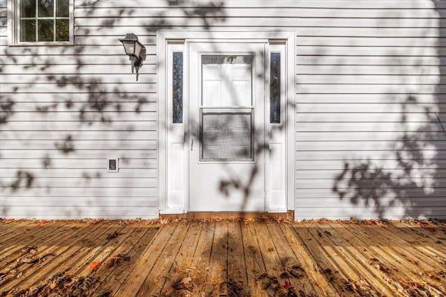 doorway to property featuring a wooden deck