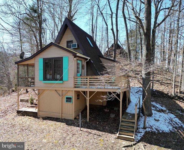 back of house featuring a wooden deck