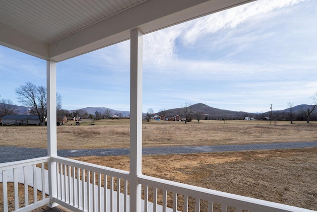 exterior space featuring a rural view and a mountain view