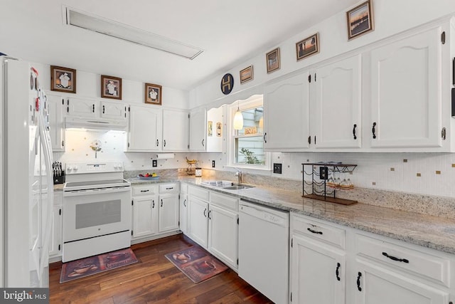 kitchen with sink, white appliances, white cabinetry, dark hardwood / wood-style floors, and light stone countertops