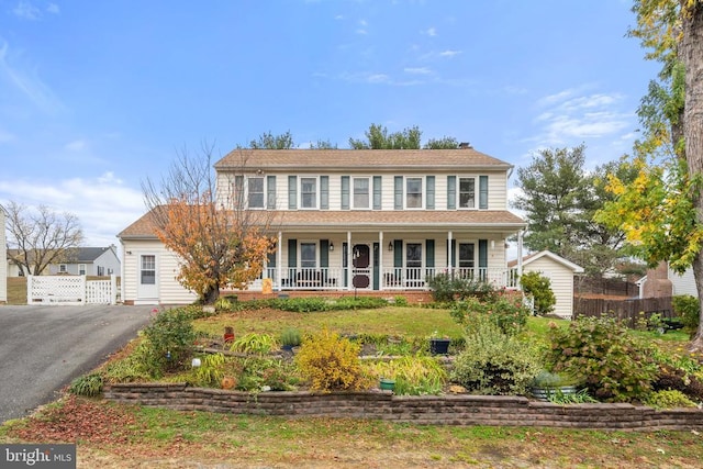 colonial-style house featuring a porch