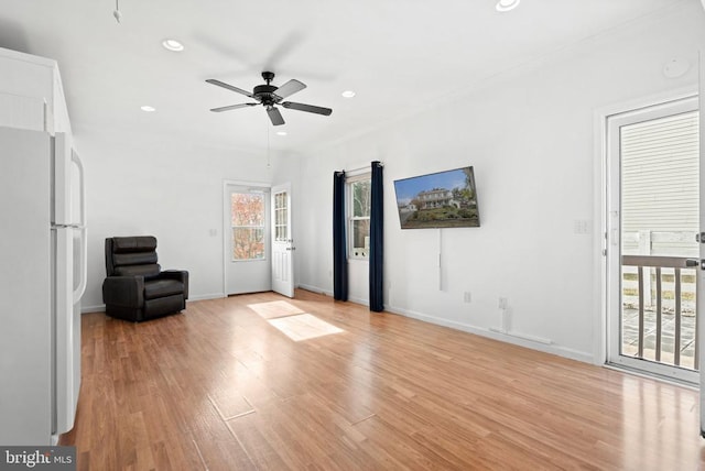 unfurnished room with light hardwood / wood-style flooring and ceiling fan