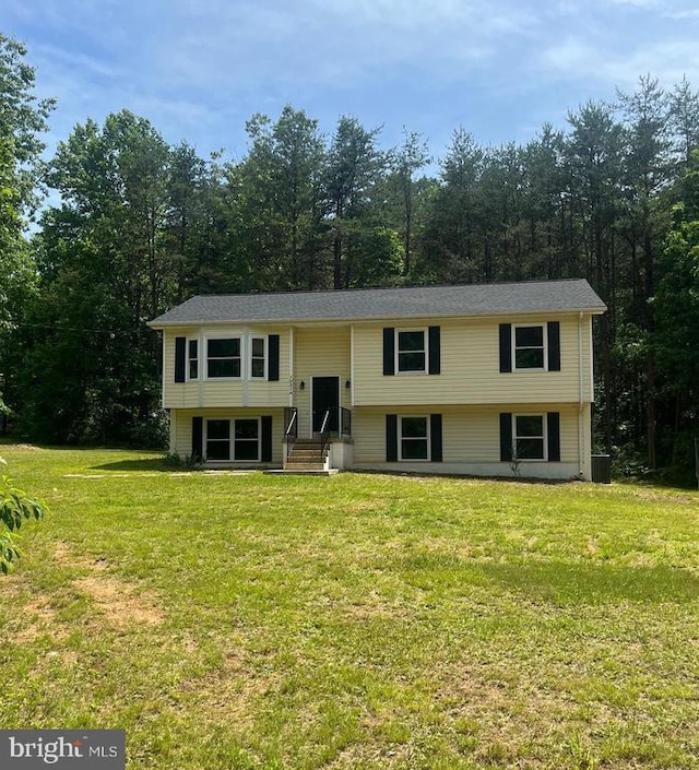 bi-level home with a front yard