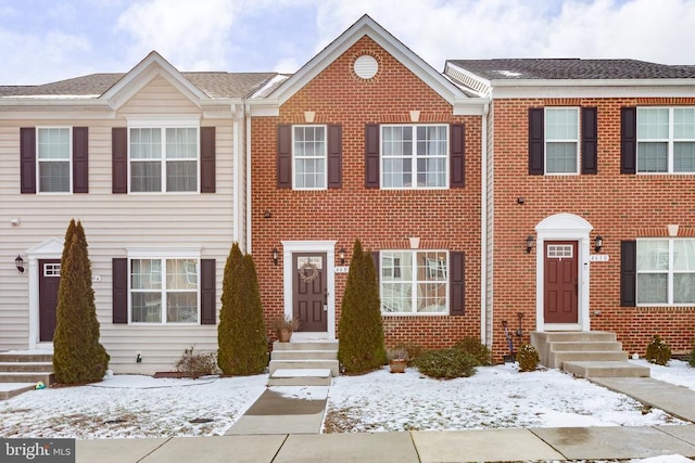 view of property with brick siding