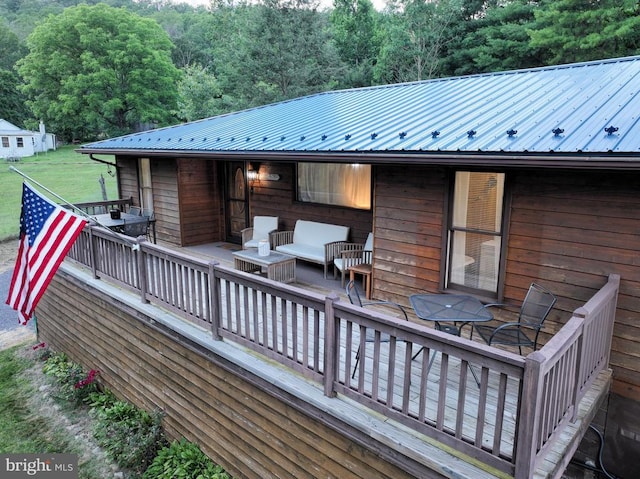 wooden terrace featuring an outdoor living space