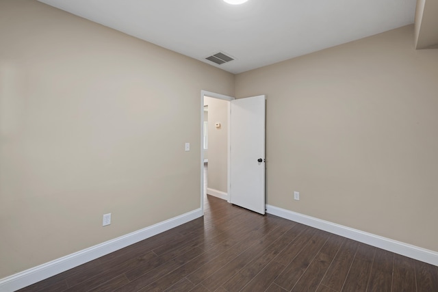 unfurnished room featuring dark hardwood / wood-style floors