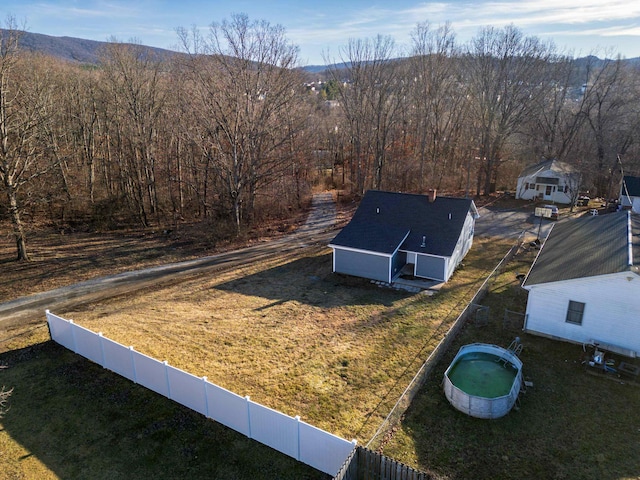 birds eye view of property with a mountain view