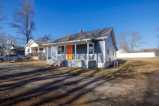 view of front of house with central AC and covered porch