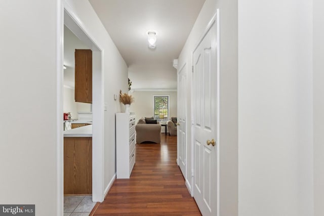 hall with wood finished floors