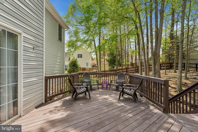 deck featuring a fenced backyard