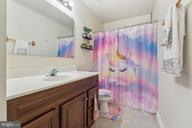bathroom with a shower with curtain, vanity, and toilet