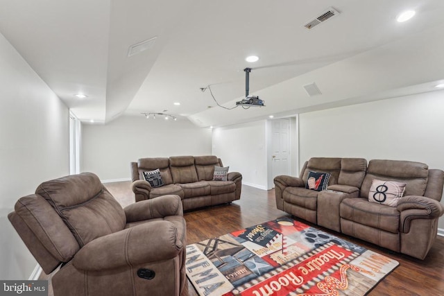 living room with baseboards, visible vents, and dark wood-type flooring