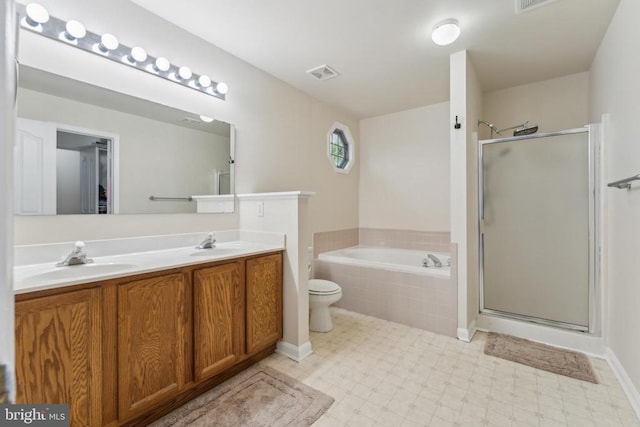 bathroom featuring a bath, visible vents, a stall shower, and a sink