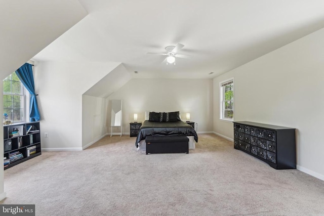 carpeted bedroom with baseboards and ceiling fan