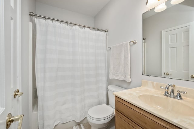 bathroom with vanity, toilet, and shower / bath combo with shower curtain