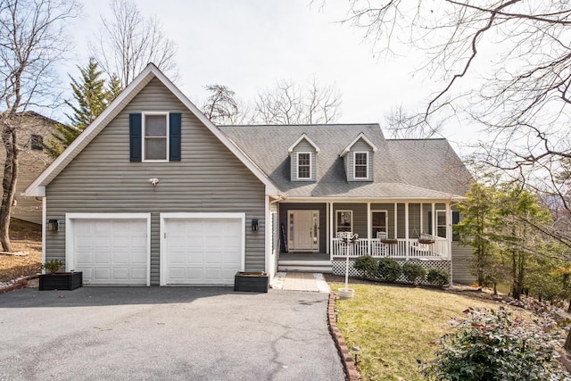 view of front of property with a front lawn, aphalt driveway, roof with shingles, covered porch, and a garage