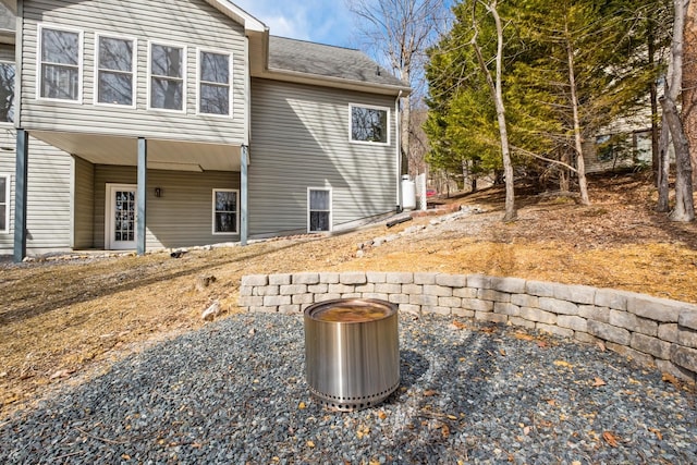 exterior space with roof with shingles