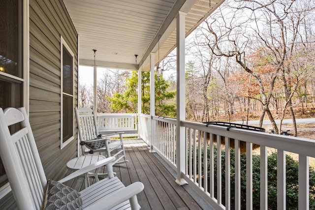 wooden deck featuring covered porch