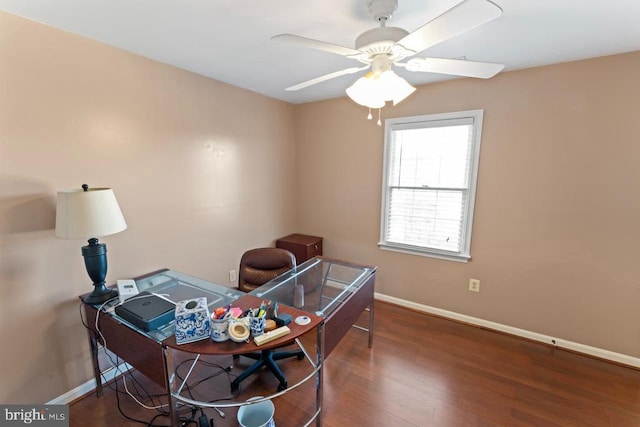 office space with wood finished floors, baseboards, and ceiling fan