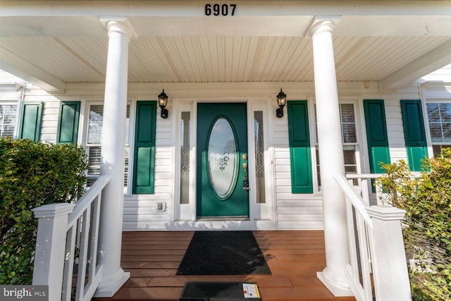 doorway to property featuring covered porch