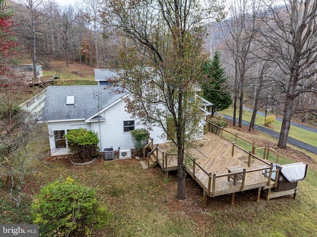 view of yard with a wooden deck and cooling unit
