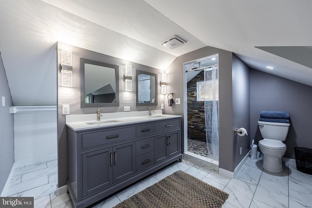 bathroom with marble finish floor, baseboards, a stall shower, and a sink
